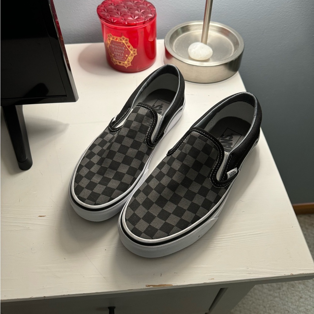 Black and gray checkered slip-on Vans